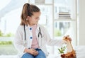 Youre all better now. a little girl pretending to be a doctor while examining her stuffed animal at home. Royalty Free Stock Photo
