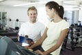 Youre doing great. an attractive young woman working out with her personal trainer. Royalty Free Stock Photo