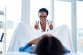 Youre doing great. a young gynaecologist giving a thumbs up during a consultation with her patient.