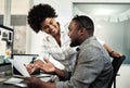 Youre doing so well. two young businesspeople looking at paperwork together in the office. Royalty Free Stock Photo