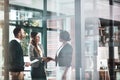 Youre going to love working here. businesswomen shaking hands in a modern office. Royalty Free Stock Photo