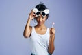 Youre gonna have to get your own lollipop. Studio portrait of a beautiful young woman sucking on a lollipop against a Royalty Free Stock Photo