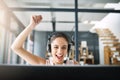 When youre good, youre good. an attractive young woman cheering while working in a call center. Royalty Free Stock Photo