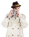 Youre in his sights...Reporter taking a photo with a retro camera against a white background. Royalty Free Stock Photo