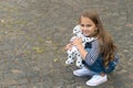 Youre my friend. Small girl play with toy dog outdoors. Little child enjoy friendship. Childhood friendship. Developing Royalty Free Stock Photo