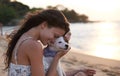 Youre my good boy. Shot of an attractive young woman enjoying the beach with her dog. Royalty Free Stock Photo