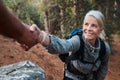 Youre always there when I need a hand. a woman reaching out for a mans hand while hiking. Royalty Free Stock Photo