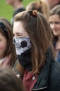 Youth activist wearing skeleton face mask at the Climate Change demonstration in London.