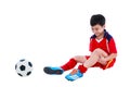 Youth asian soccer player with pain at leg. Full body.