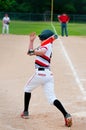 Youth baseball batter swinging bat.