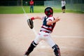 Youth baseball catcher throwing to second base. Royalty Free Stock Photo