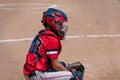 Teen baseball catcher behind home plate. Royalty Free Stock Photo