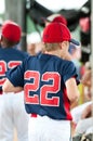 Youth baseball player in the dugout