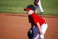 Youth baseball player hands on knees