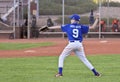 A Youth Baseball Player Throws the Ball