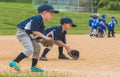 Youth Baseball Players Fielding Ground Balls