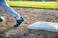 Youth baseball with a runner taking off for the next base Royalty Free Stock Photo