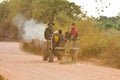 Youth farmers coming home by their farm vehicle one road Royalty Free Stock Photo