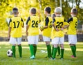 Youth football soccer training. Young boys training soccer on sports pitch Royalty Free Stock Photo