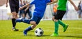 Youth Football Teams Playing Match on Sports Field. Young Boys Kicking Match