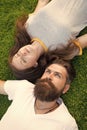 Youth and freedom. Couple in love relaxing lay meadow. Freshness and peace. Hipster bearded man and girl happy carefree