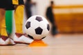 Youth futsal league. Indoor football player with classic soccer ball. Indoor soccer sports hall Royalty Free Stock Photo