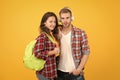 Youth lead way in fashion ideas. Hipster couple students. Fashionable students couple yellow background. Modern couple