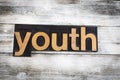 Youth Letterpress Word on Wooden Background