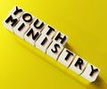 Youth ministry words on the white cubes in the yellow background Royalty Free Stock Photo