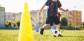 Youth Soccer Training Drill With Cone. Child Practicing Dribbling and Ball Control Royalty Free Stock Photo