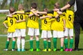 Youth sports team. Young players standing together with coach Royalty Free Stock Photo
