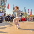 : youth street dances. A young girl performs dance moves. Text in Russian: Caramel Supermarket Royalty Free Stock Photo