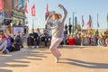 : youth street dances. A young girl performs dance moves. Text in Russian: Caramel Supermarket Royalty Free Stock Photo