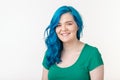 Youth, stylish and fashion concept - Young beautiful woman with blue hair is smiling over white background with copy Royalty Free Stock Photo