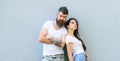 Youth stylish outfit. Couple friends hang out together grey wall background. Feel their style. Couple white shirts