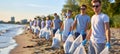 Youth volunteers in coastal cleanup at sunrise with eco friendly tools and recyclable bags