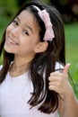 Youthful Asian Girl Child With Thumbs Up Royalty Free Stock Photo