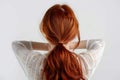 Youthful beauty Red haired womans back view, white background, copy