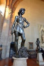 David by Andrea del Verrocchio with DonatelloÃ¢â¬â¢s David in the Background Ã¢â¬â National Museum of Bargello Royalty Free Stock Photo