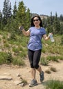 Youthful fifty-two year-old Korean mother on a hike in Mount Rainier National Park, Washington Royalty Free Stock Photo