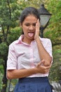 Youthful Filipina Girl Poor Health Wearing Pink Shirt In Park