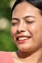 Youthful Filipina Woman With Eyes Closed Royalty Free Stock Photo