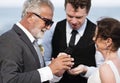 Youthful mature couple getting married at the beach