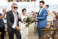 Youthful mature couple getting married at the beach Royalty Free Stock Photo