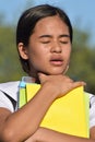 Youthful Philippine Girl Choking With Books Royalty Free Stock Photo