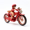 Youthful Protagonist Toy Figure Riding Red Motorcycle Royalty Free Stock Photo