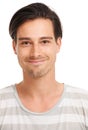 Youthful spirit. Handsome young man smiling sweetly at the camera, on white - copyspace.