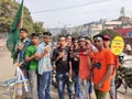 Youths are celebrating National Victory Day of Bangladesh wearing band which embossing Flag of Bangladesh and showing victory.