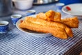 Youtiao Chinese fried churro, Chinese cruller, Chinese oil stick, Chinese doughnut, fried breadstick, long golden brown deep