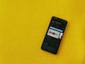 YouTube Kids app play store page on smartphone on a yellow fabric background